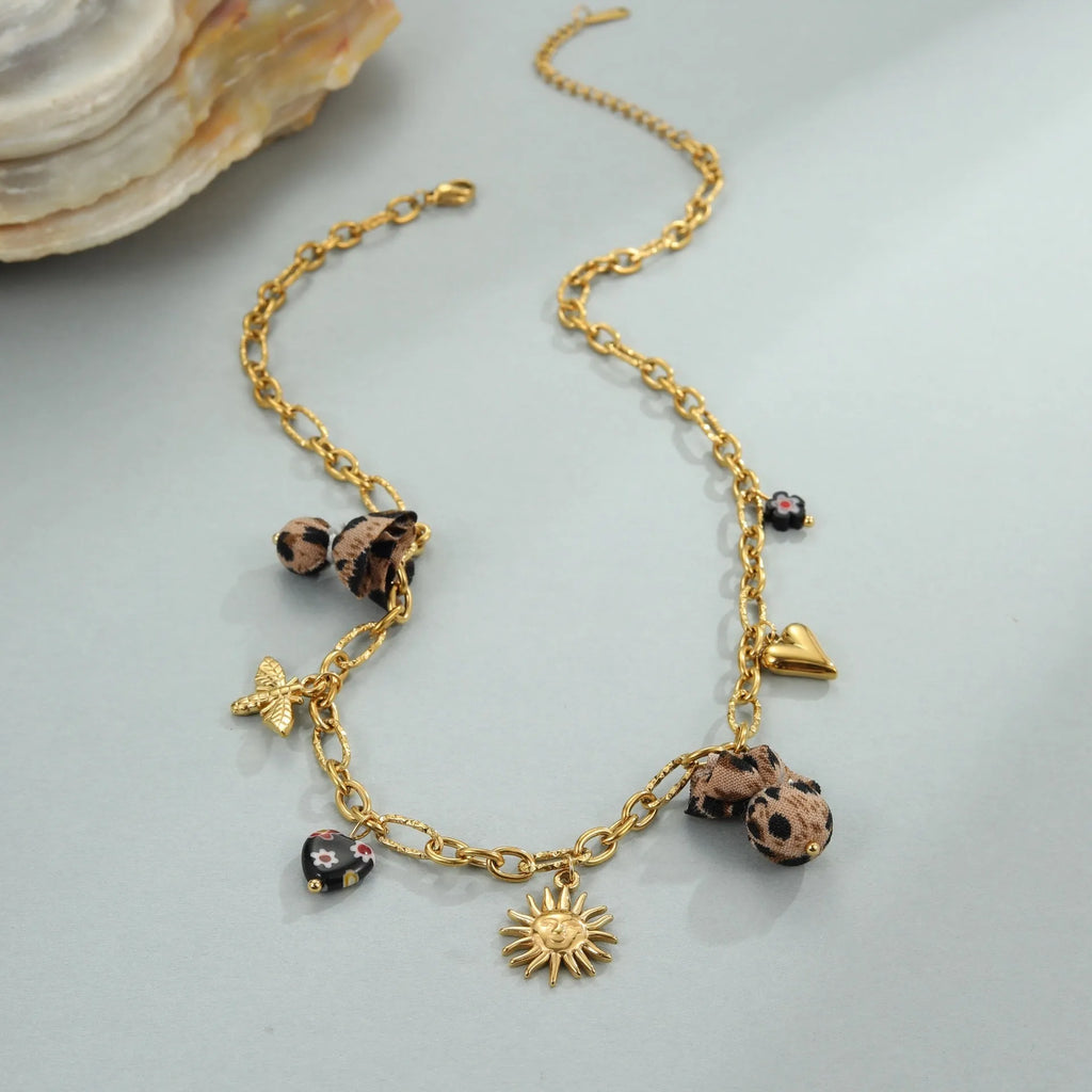 Stainless steel necklace with a geometric leopard and love heart flower pendant on an adjustable chain.