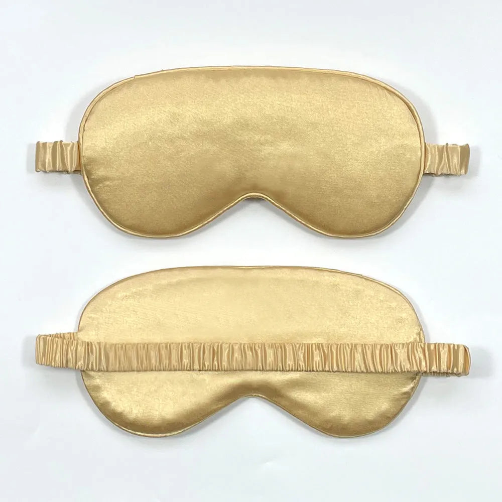 Rayon satin double-sided sleep mask in a selection of solid colours on a white background.