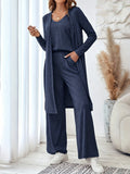 Blue women's three-piece casual suit set with sling top, cardigan, trousers, and suspenders.