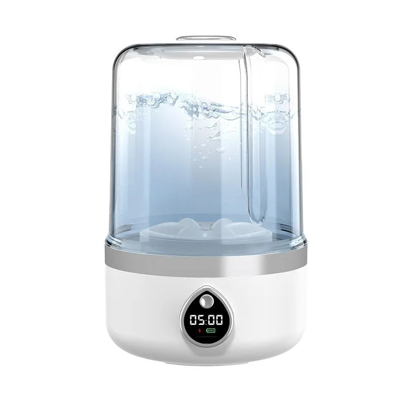 Compact white plastic portable washing machine with USB power cable.