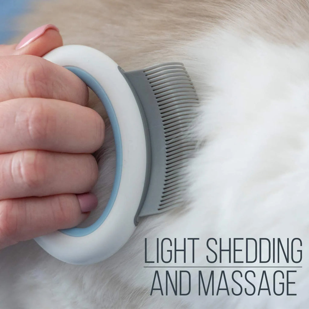 Blue pet deshedding comb with soft teeth and ergonomic handle for cats and dogs.