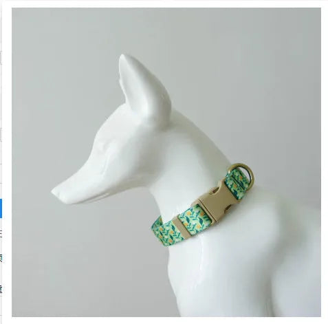Flower patterned nylon pet collar with metal buckle, shown in Hanada colour on a size chart.
