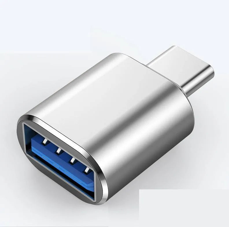 USB Type-C male to USB-A female OTG adapter shown in black, silver, and gold colour options.