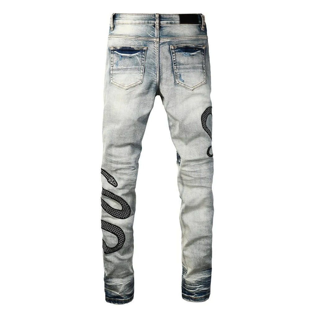 Man wearing 8934Blue distressed skinny jeans with a retro wash and skinny leg fit.