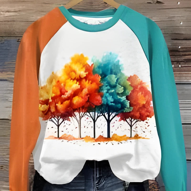 Green women's hoodie with a raised 3D cartoon character print on the front, featuring long sleeves and a pullover design.