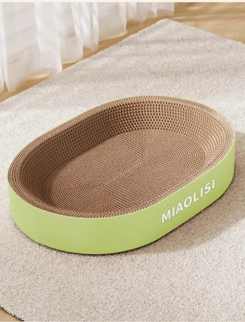 Green oval corrugated paper cat scratch nest showing textured surface and 55cm diameter.