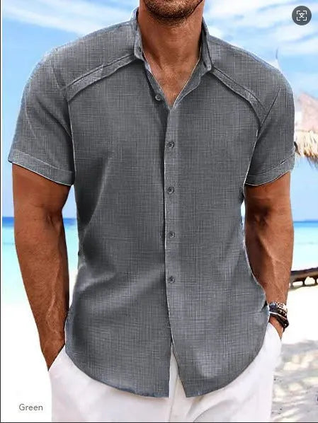 Man wearing a solid colour Hawaiian casual short sleeve shirt in a cotton blend fabric.