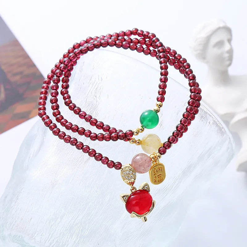 Purplish red garnet crystal fox bracelet with adjustable rope fastening for women