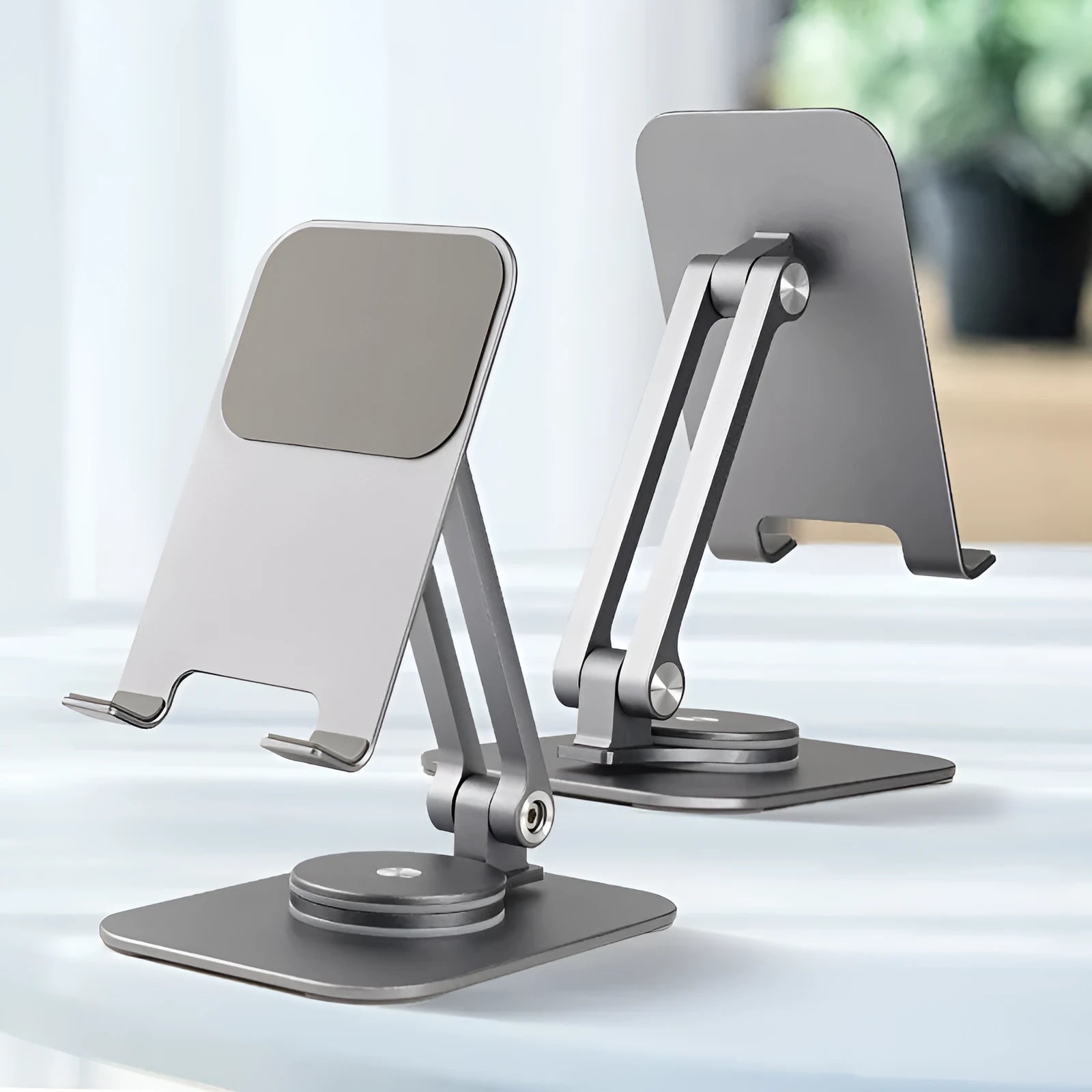 Aluminium alloy rotary desktop phone holder with silicone pad, silver grey finish, unfolded on desk