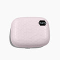 Pearl white automatic ultrasonic flushing instrument for cleaning invisible glasses on a table.