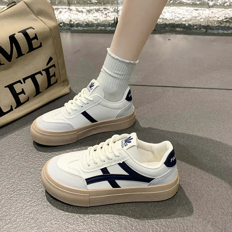 Blue and brown low-top casual board shoes with round toe and flat rubber sole.