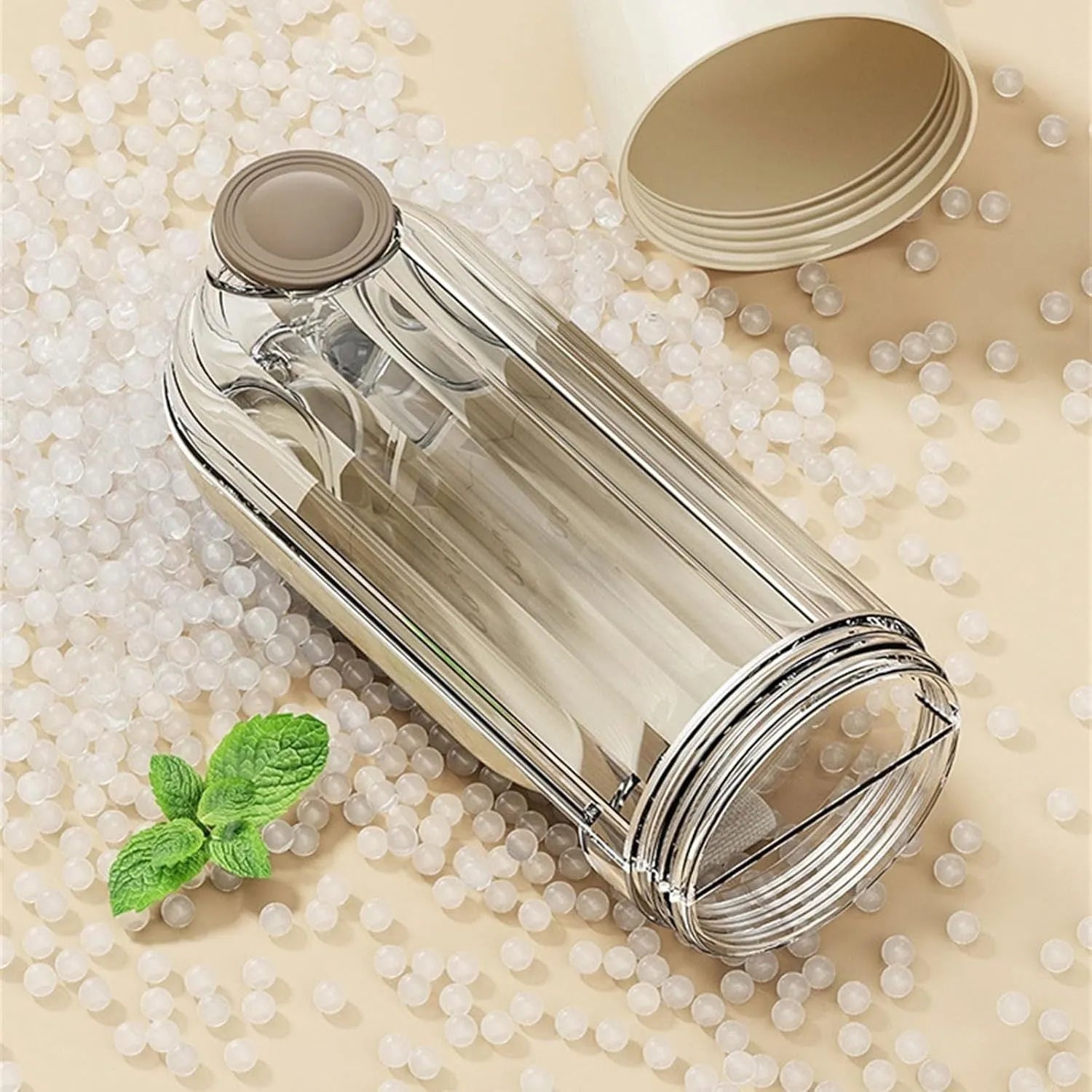 Beige and green foldable dog water bottle with food container, showing scale next to a dog's muzzle.