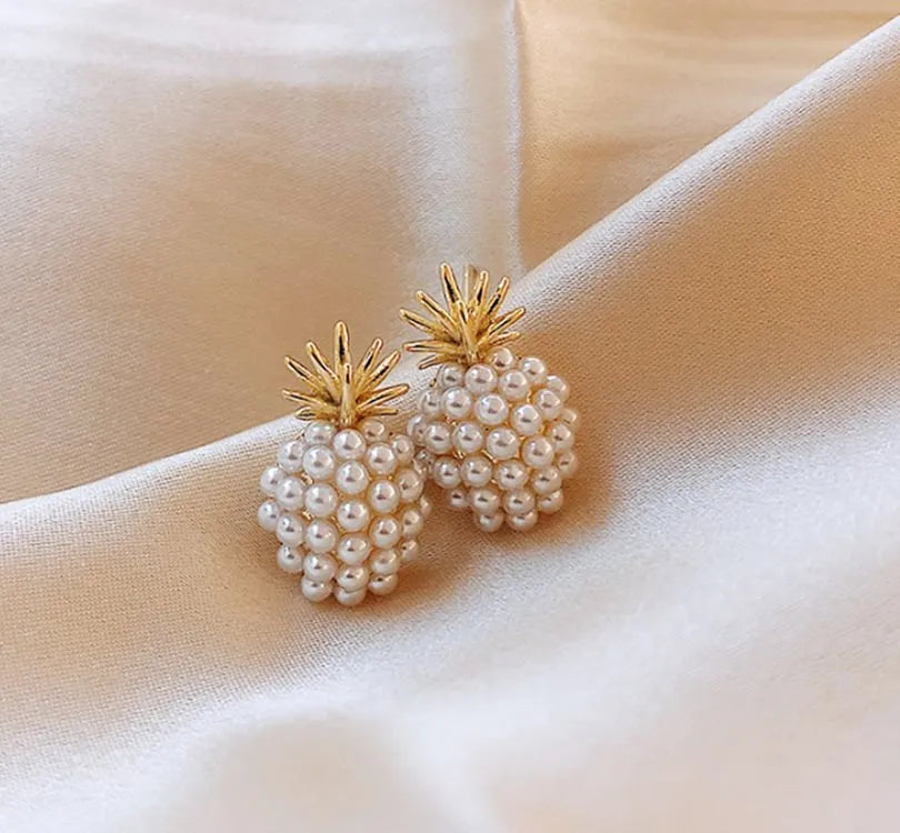 Women's gold Korean style alloy earrings with pineapple and starfish charms inlaid with artificial gems.