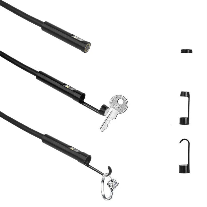 WiFi dual lens endoscope camera with 5.5mm and 8mm probes, magnet, and hook accessories on a table.