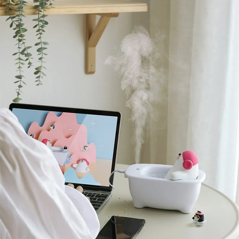 White USB air humidifier and essential oil diffuser with 550ml water tank on a desk.