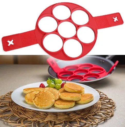 Red silicone egg mould set with heart, lace, round, square and 7-hole shapes on a white background