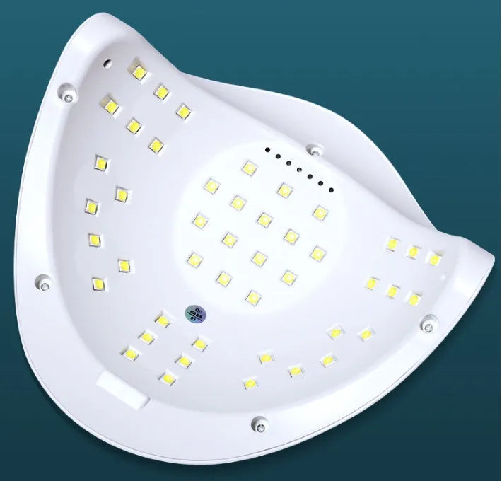 White nail polish dryer lamp with 45 LED/UV beads inside the curing chamber.