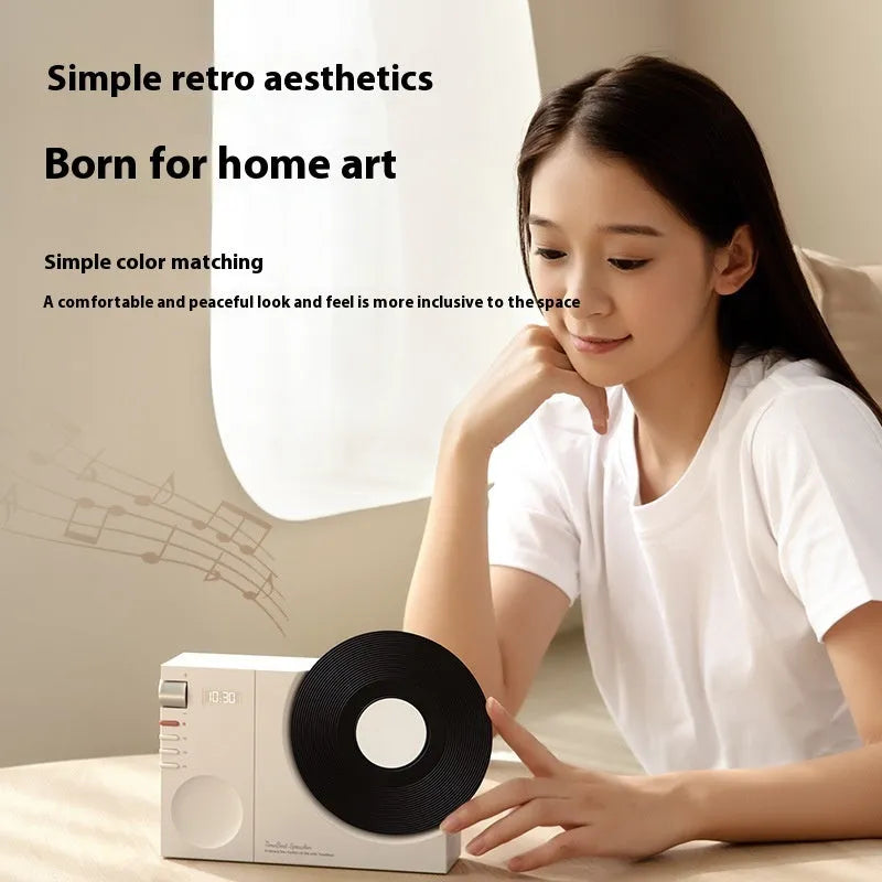 Mini portable Bluetooth speaker in Obsidian Black with USB charging port and card insertion slot.