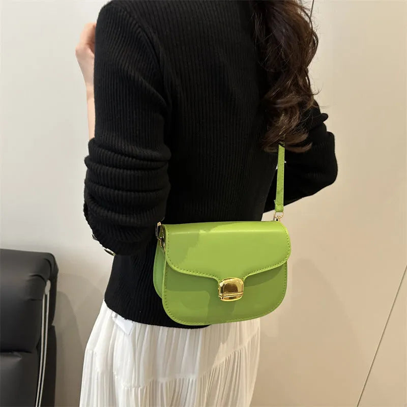 Simple PU leather women's handbag showing internal zipper pocket and phone compartment