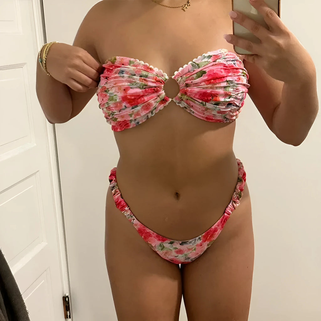Floral printed lace bikini top in blue, shown as a sleeveless, backless tube top for swimming.