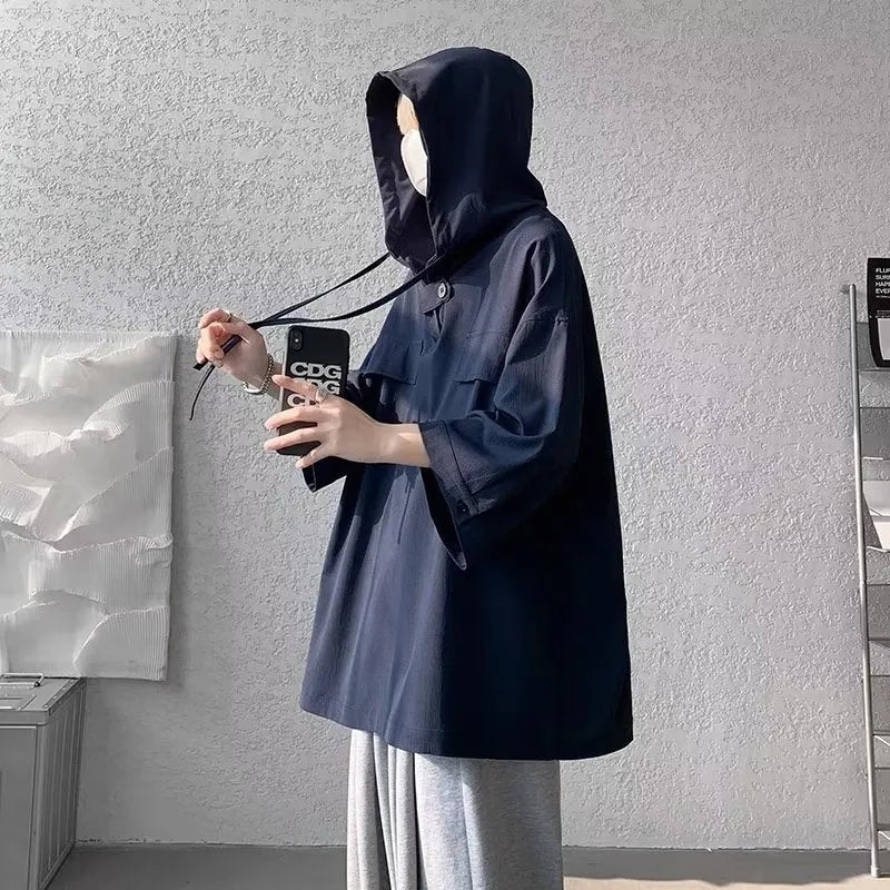 Men's hooded short sleeve t-shirt in loose fit available in multiple colours including black, white, and blue