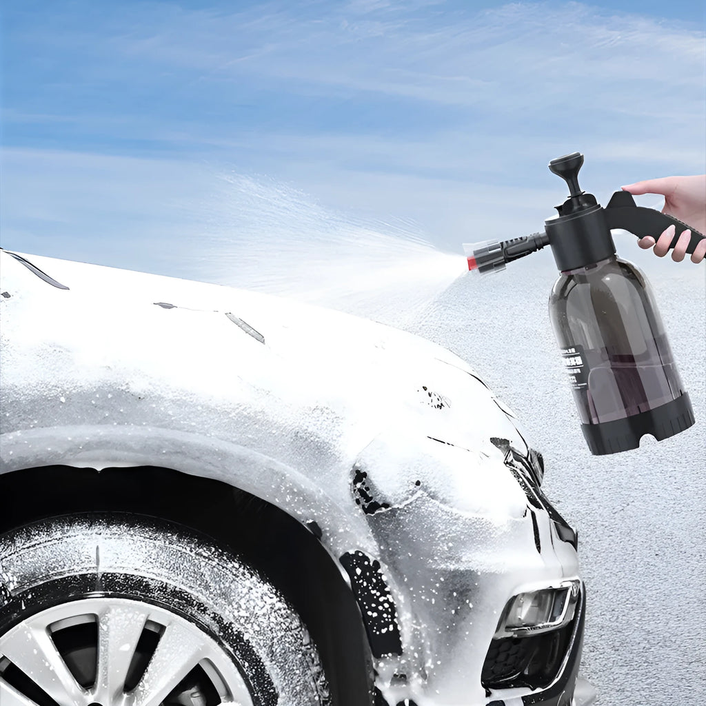 Black handheld 2L foam watering can sprayer with two nozzles and a comfort-grip handle.