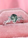 S925 silver ring with drop-shaped natural agate stone and branch leaf edge design on white background