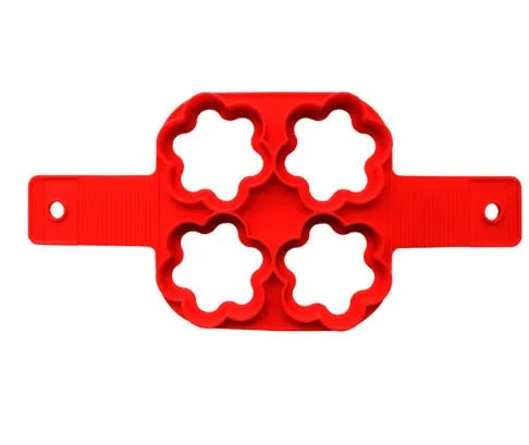 Red silicone egg mould set with heart, lace, round, square and 7-hole shapes on a white background