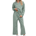 Women's solid colour knitted jacquard suit with long sleeve top and elastic waist cropped trousers.