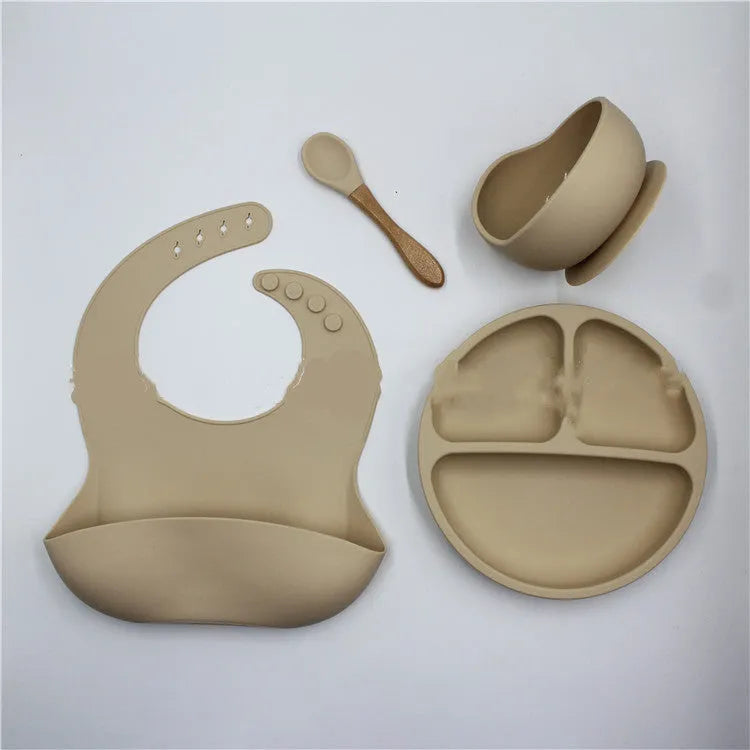 4 piece food grade silicone baby feeding set with bib, plate, bowl, and spoon in dark grey, khaki, or rose red