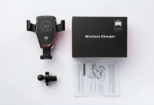 Black wireless car charger mounted on vehicle vent with iPhone secured in automatic clamping mechanism