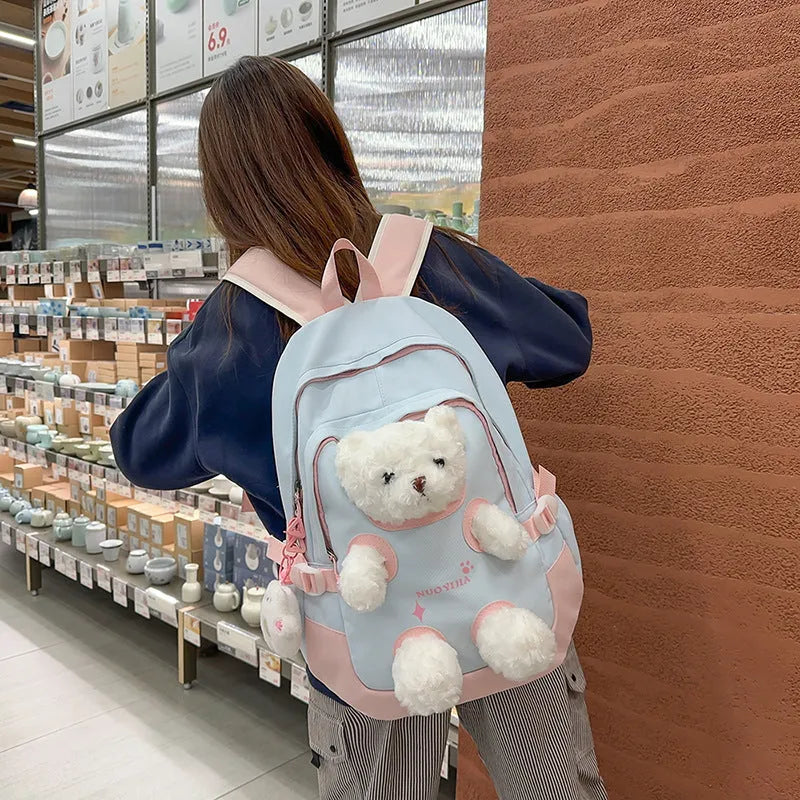 Nylon school backpack with curved shoulder straps in macaron colours including yellow pink
