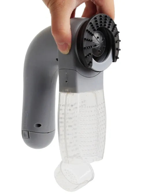 Grey portable pet hair vacuum cleaner with soft rubber head for grooming dogs and cats.