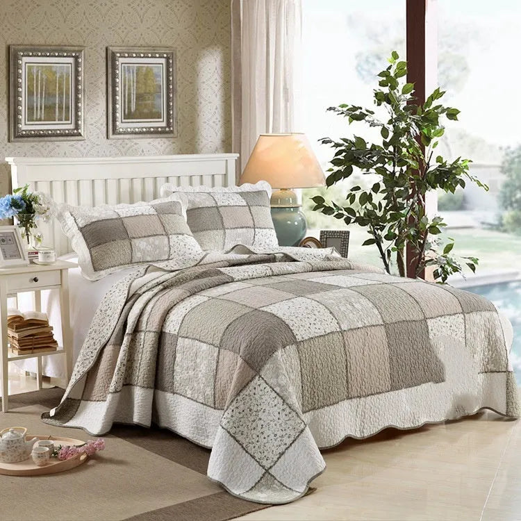 Washed pure cotton quilted bedspread three-piece set in a beige colour, shown on a bed.
