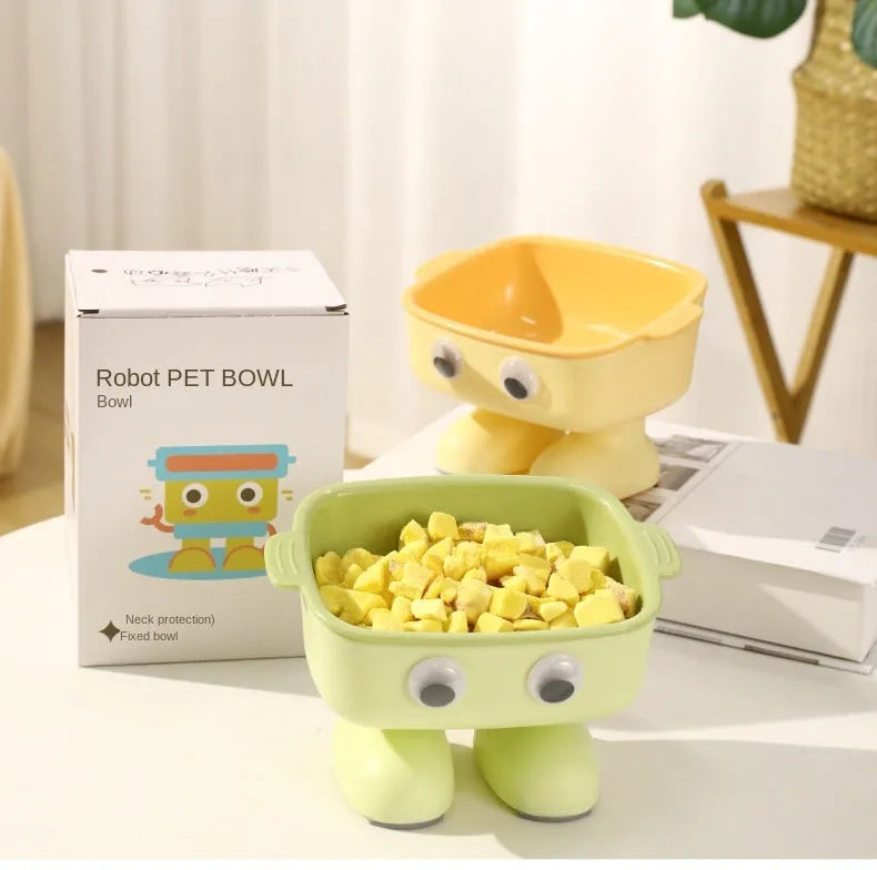Green robot-shaped elevated cat bowl with tilted food surface and non-slip base