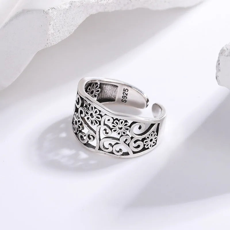 Silver plated open ring with hollow flower design, adjustable opening, retro style, colour retro JZ02137