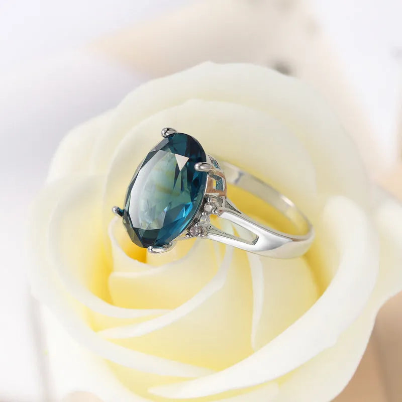 Blue black decorative ring with geometric ellipse shape and electroplated copper finish, unisex style