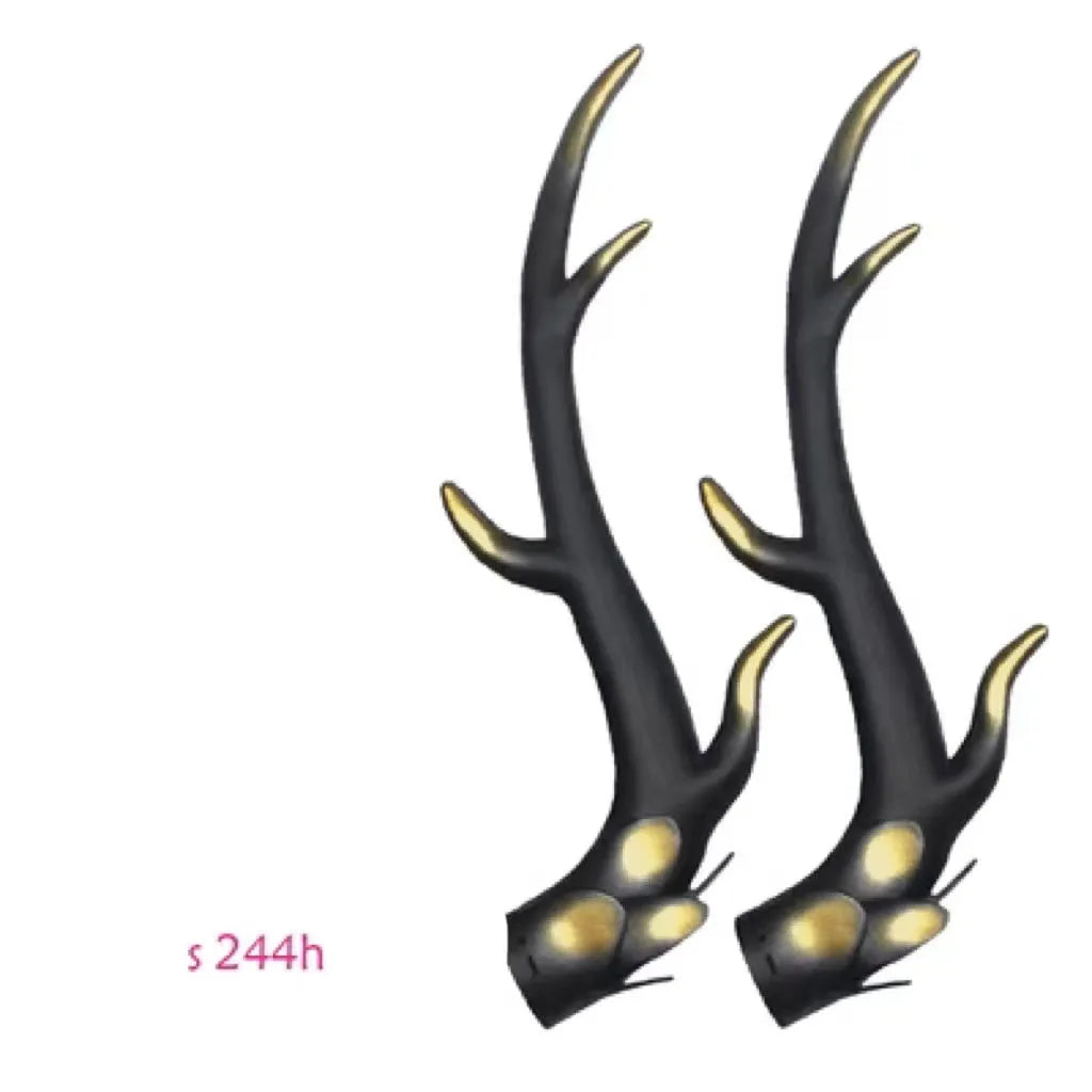A pair of black resin dragon horn decorations for motorcycle helmets, showing curved shape and textured surface.