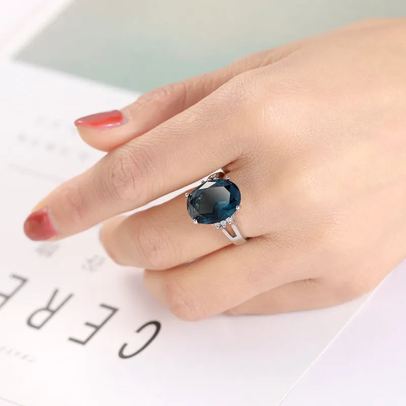 Blue black decorative ring with geometric ellipse shape and electroplated copper finish, unisex style