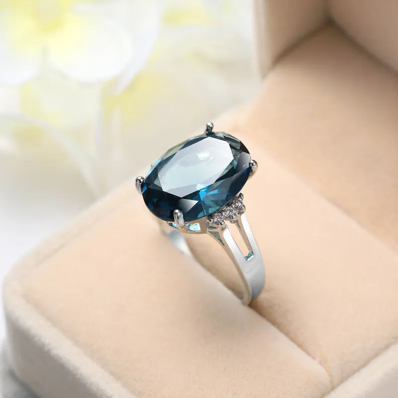 Blue black decorative ring with geometric ellipse shape and electroplated copper finish, unisex style