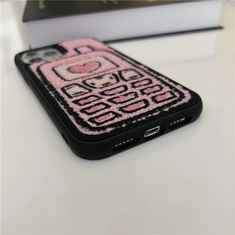 Pink TPU iPhone back cover case with a textured towel embroidered design.