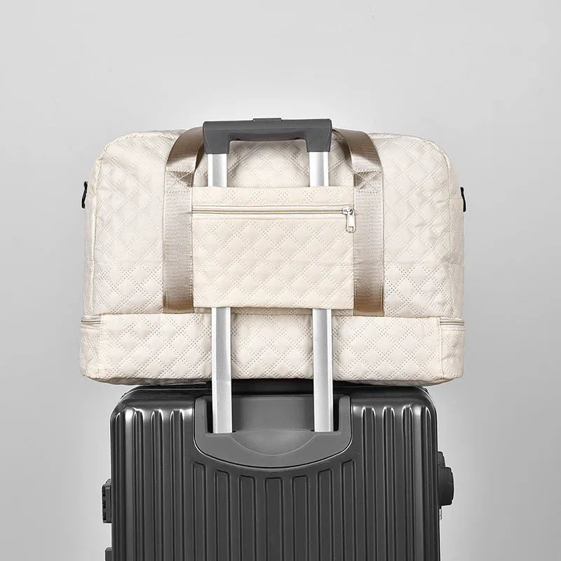 Large capacity Oxford cloth travel bag in a solid colour with visible sewing thread detail.