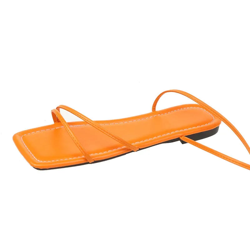 Women's ankle ring bandage cloth flat sandals in white, with front lace-up and square toe on a rubber sole.