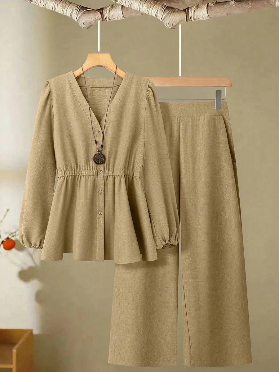 Women's woven polyester two-piece suit in wine red with button-front long-sleeved top and matching full-length trousers