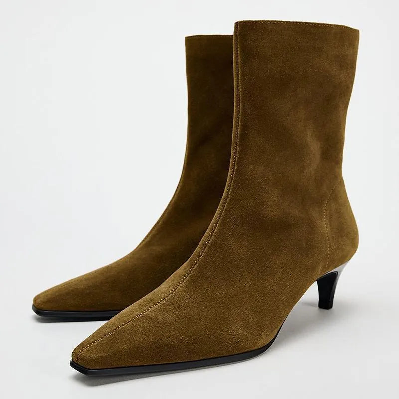 Brown square toe ankle boot with a side zip and a waterproof platform kitten heel.