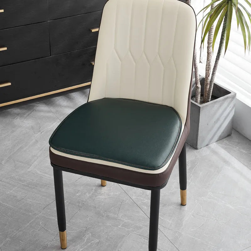 Leather horseshoe-shaped seat cushion with non-slip base in beige colour