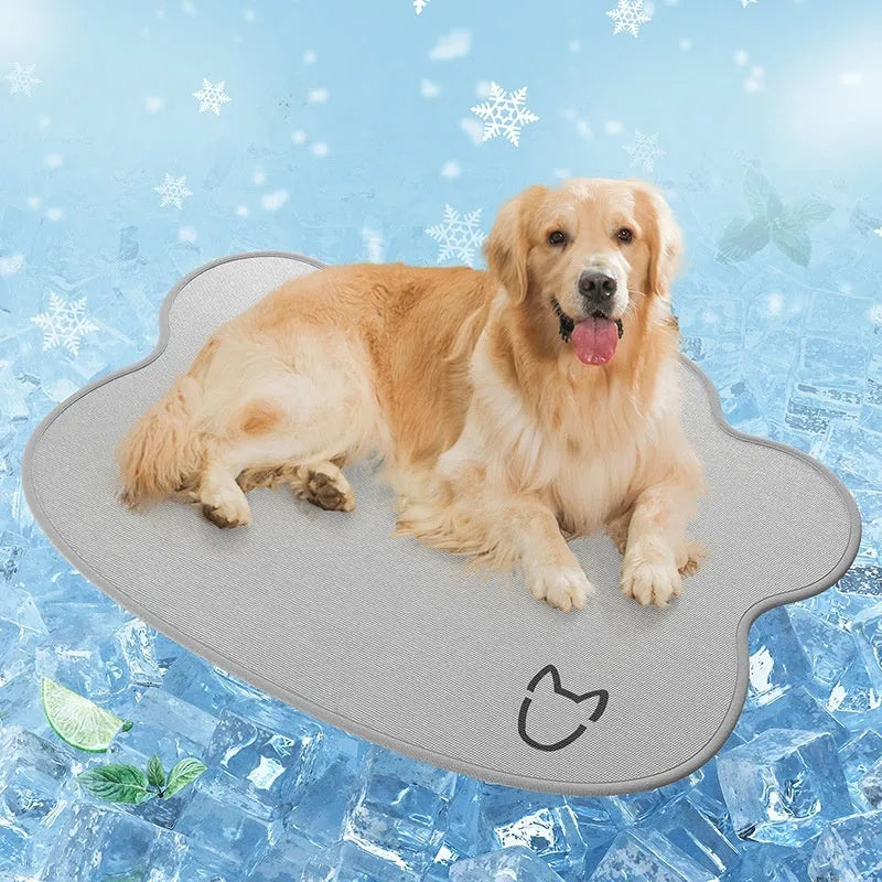 Ice silk dog cooling mat with simple dog head shape print, shown in a light grey colour on a wooden floor.