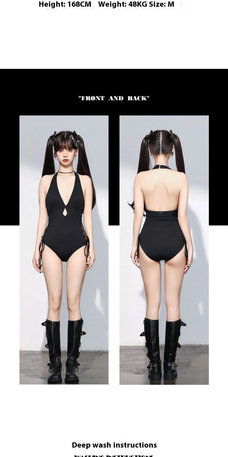 Black women's one-piece swimsuit with V-neck and hollow strap detail.
