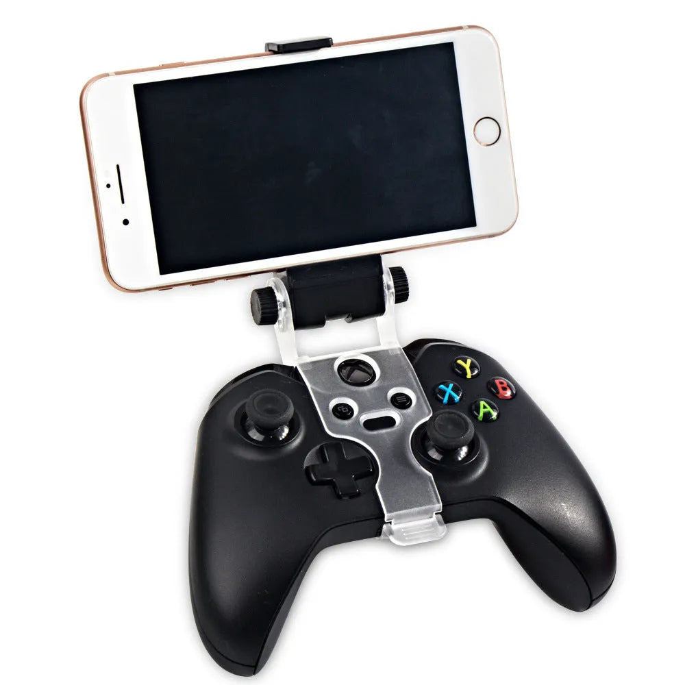 Universal black magnetic mobile phone holder mounted on car dashboard for hands-free driving