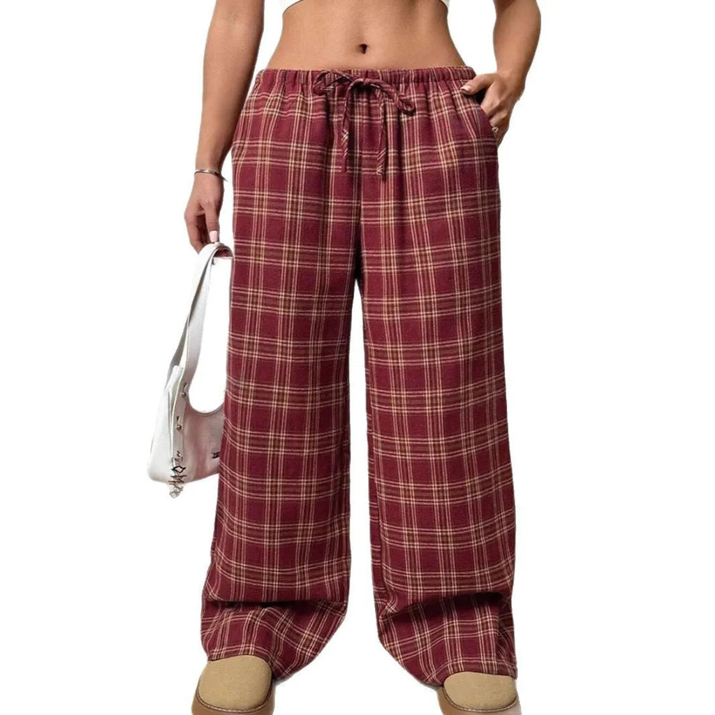 Women's loose fit plaid trousers with a drawstring waist and side pockets, shown in blue.